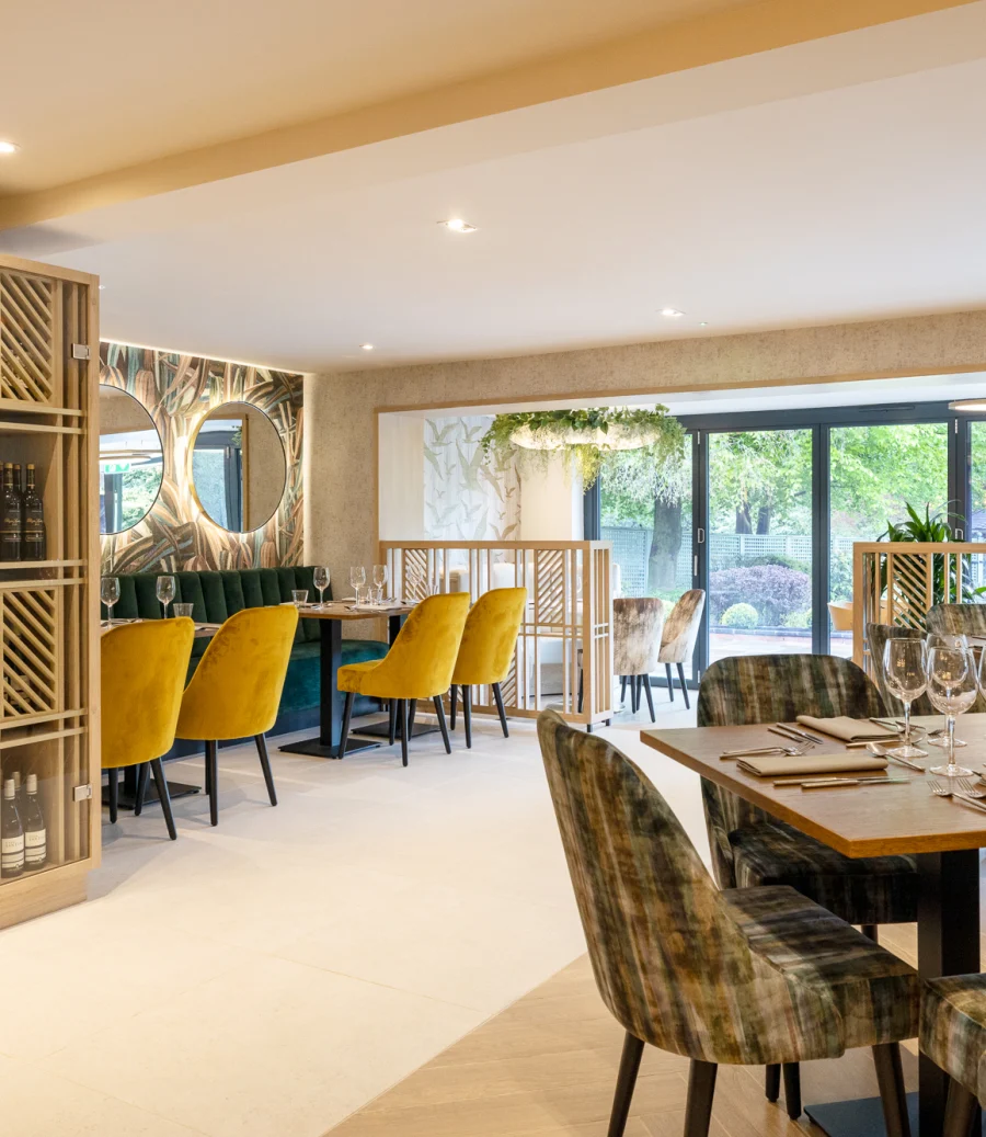 Dining room at The Oak House, with a wine wall and lakeside windows