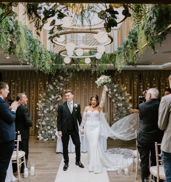Bride and groom at their wedding ceremony at Moddershall Oaks